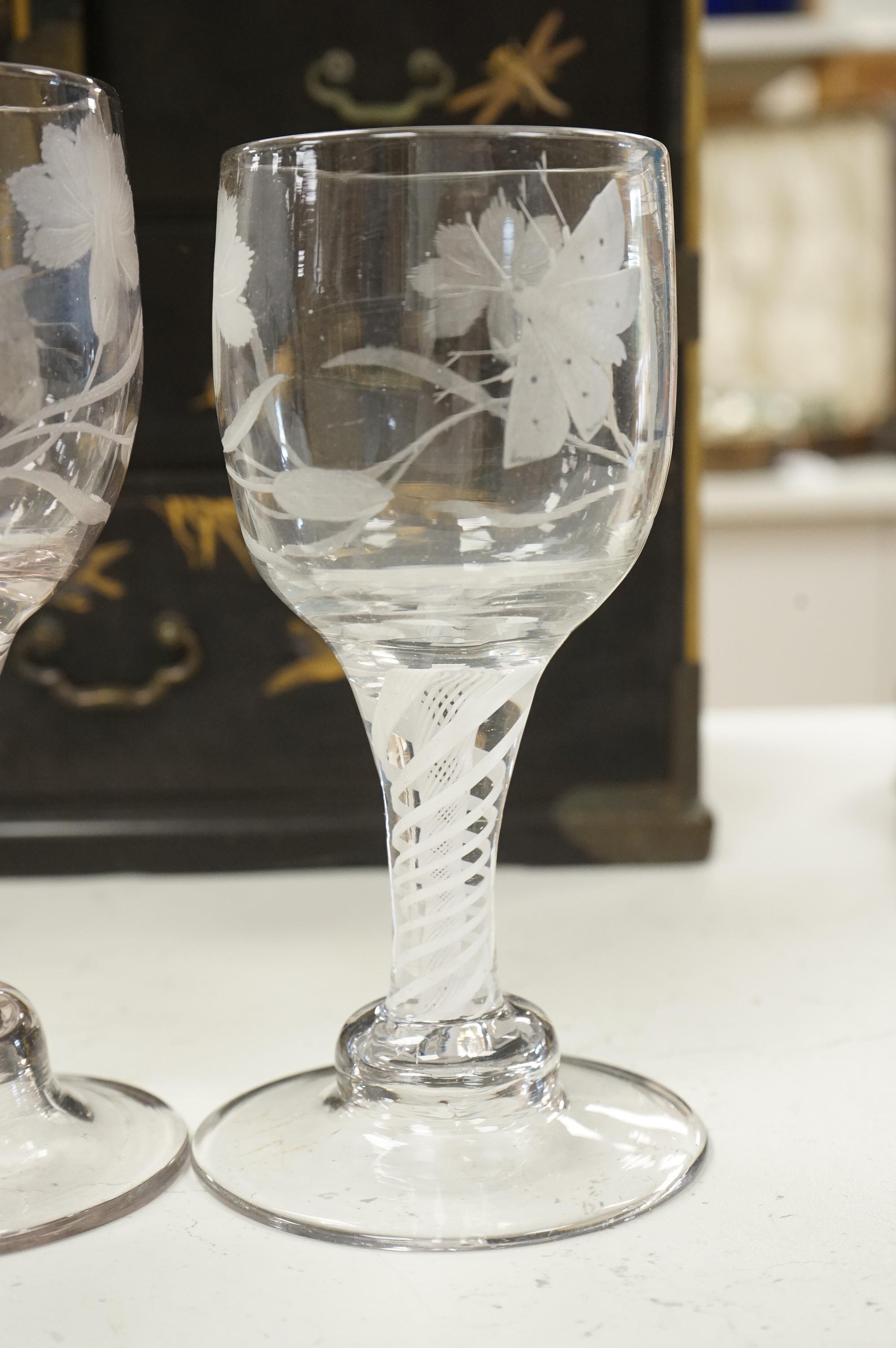 Three late 18th century Dutch DSOT stem goblets, each on a domed foot, engraved with a moth and flowers, 19.5cm and 18cm high